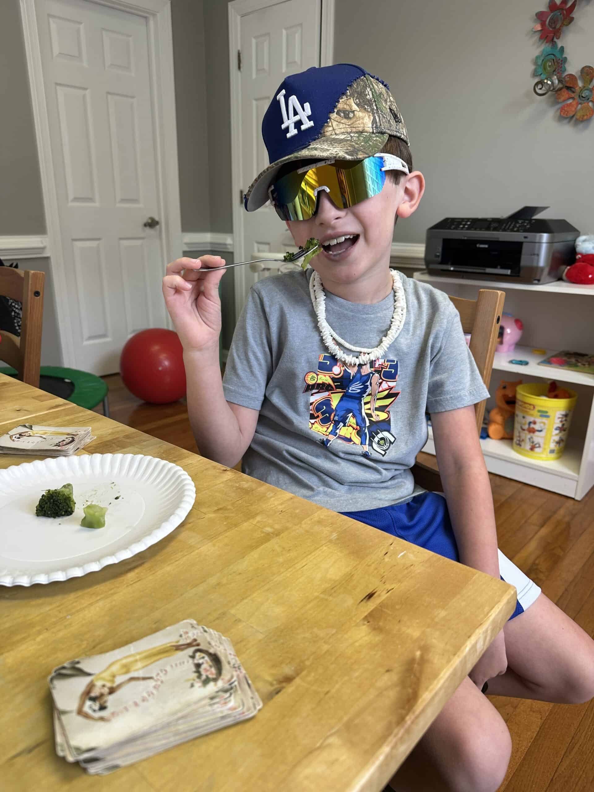 Child wearing cap and necklace