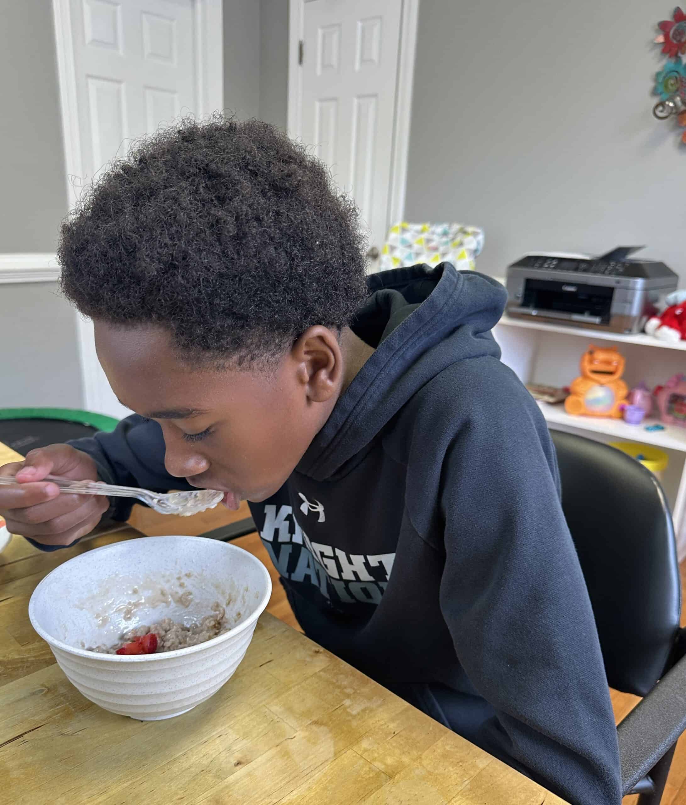 Child eating from a bowl.
